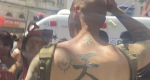 Aqui não se cria: turista com tatuagens nazistas leva surra de foliões